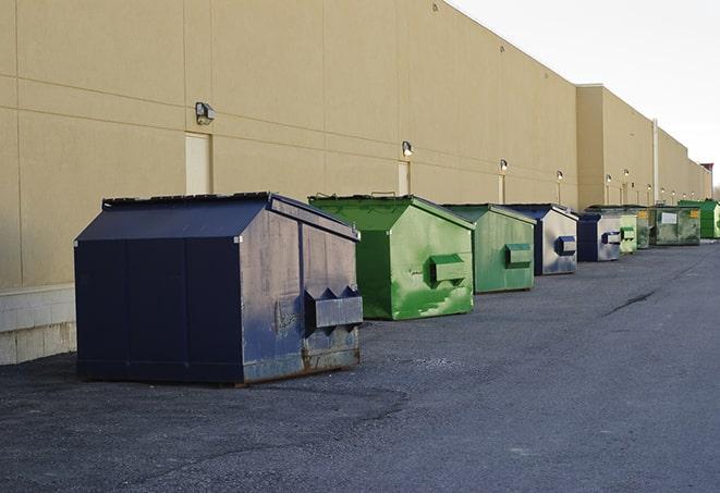 waste disposal bins at a construction zone in Ackley